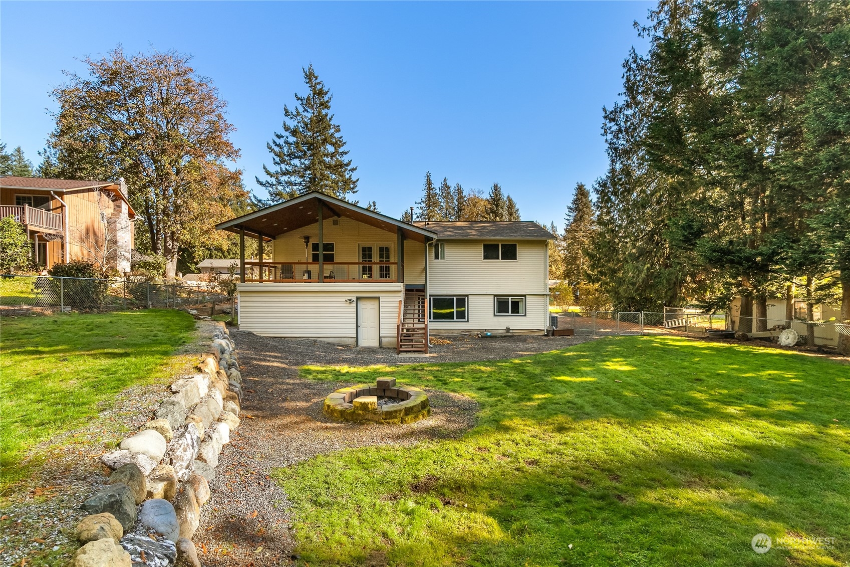 5917 Longdin Road Ferndale, WA 98248 - Photo 32 of 36 a view of a house with a big yard and large trees