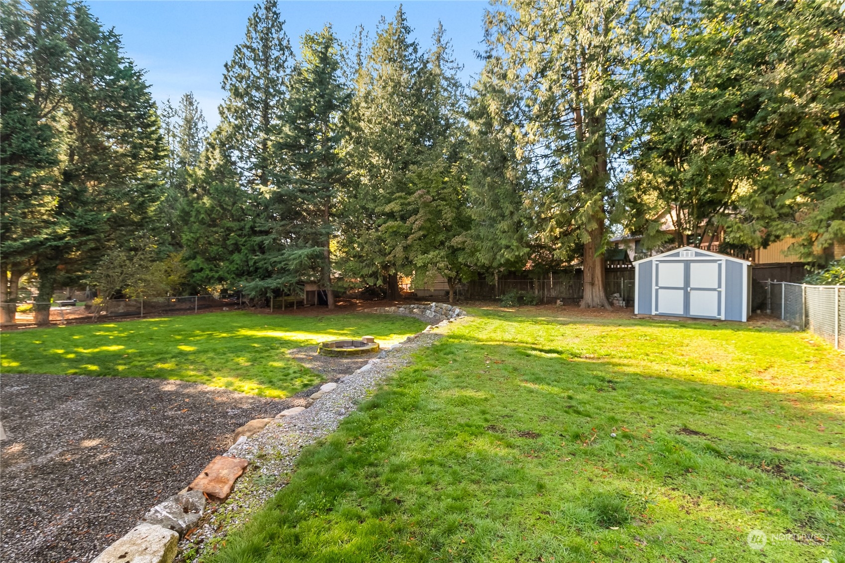 5917 Longdin Road Ferndale, WA 98248 - Photo 34 of 36 a view of a swimming pool with a yard and trees