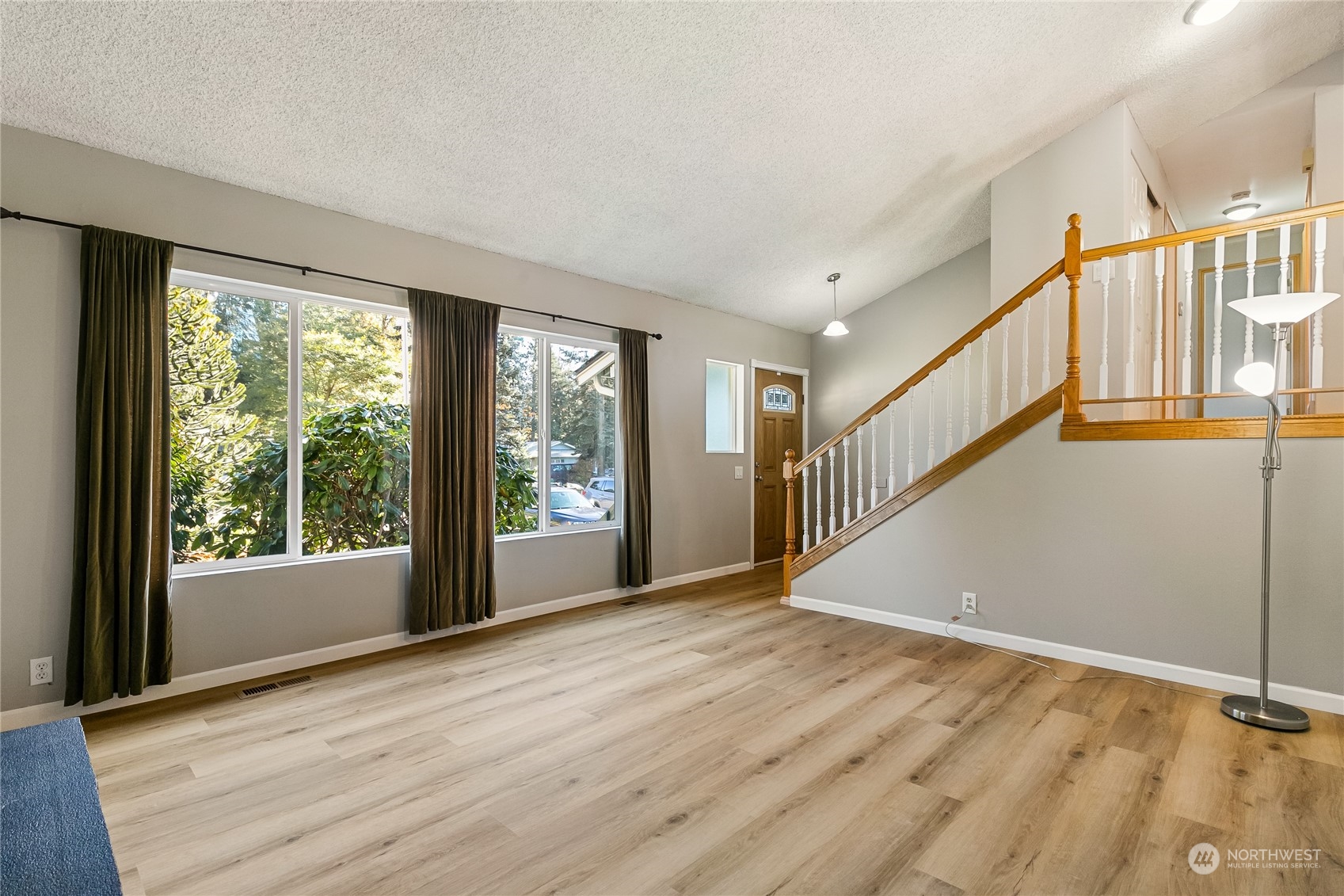 5917 Longdin Road Ferndale, WA 98248 - Photo 7 of 36 a view of an empty room with wooden floor and a window