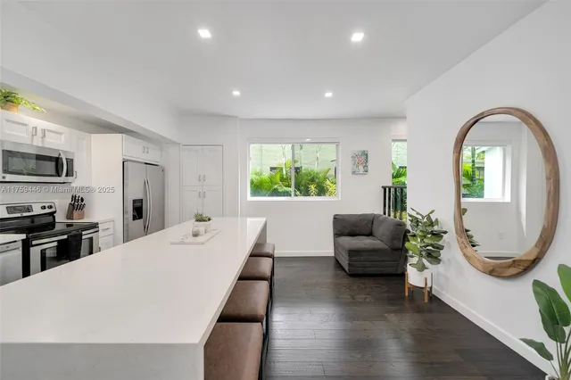 a view of living room with furniture and a fireplace