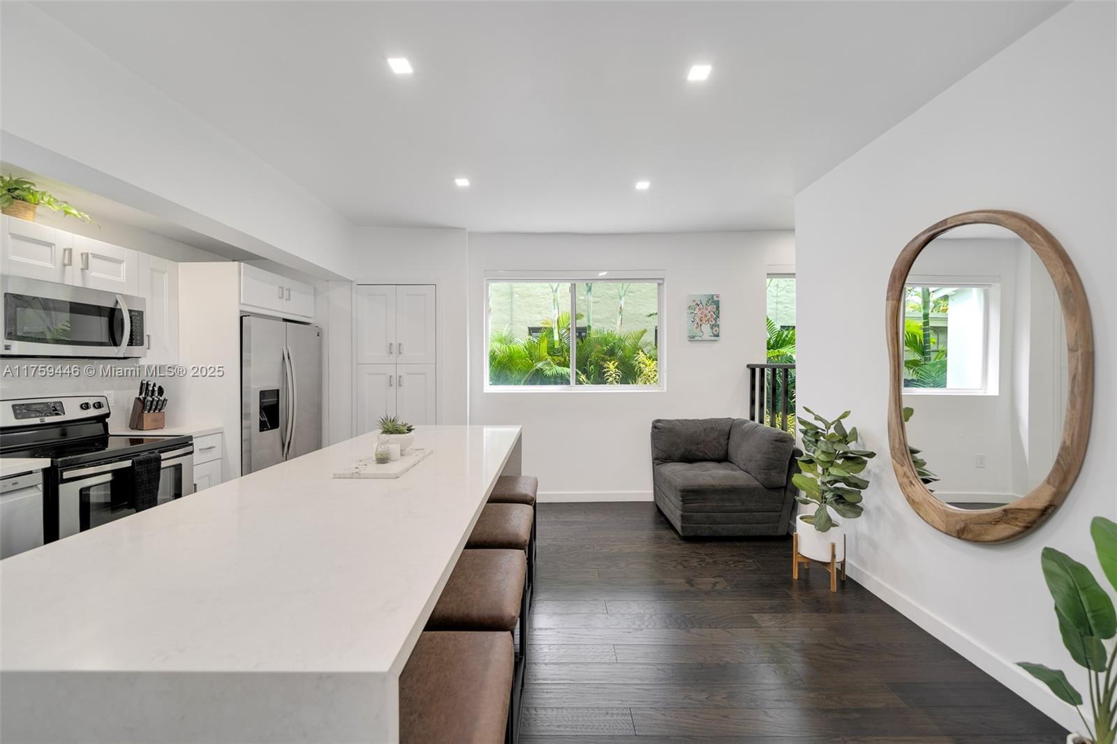 1745 Southwest 10th Street Miami, FL 33135 - Photo 13 of 51 a living room with furniture a window and a chandelier