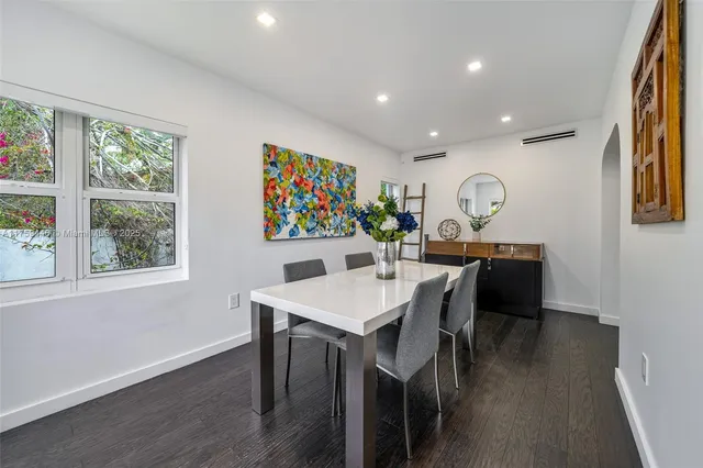 a room with furniture and a wooden floor