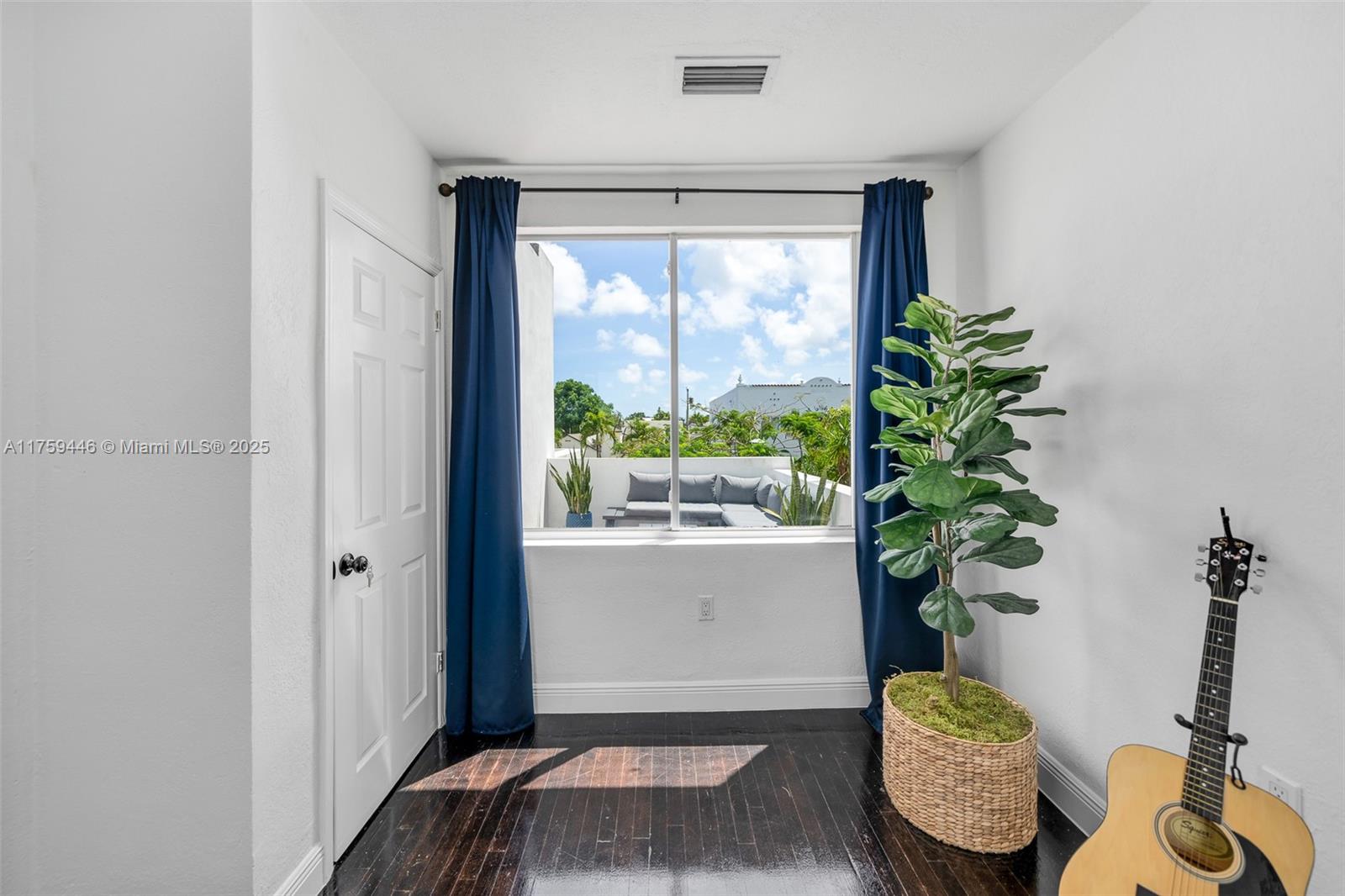 1745 Southwest 10th Street Miami, FL 33135 - Photo 27 of 51 a bedroom with furniture and a potted plant