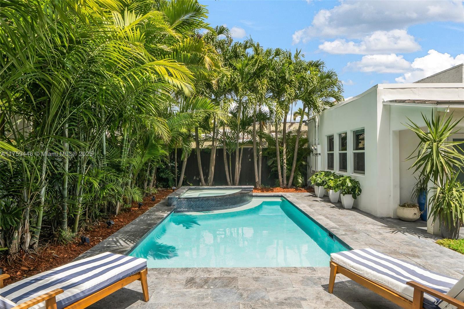 1745 Southwest 10th Street Miami, FL 33135 - Photo 31 of 51 a view of a backyard with plants and a patio