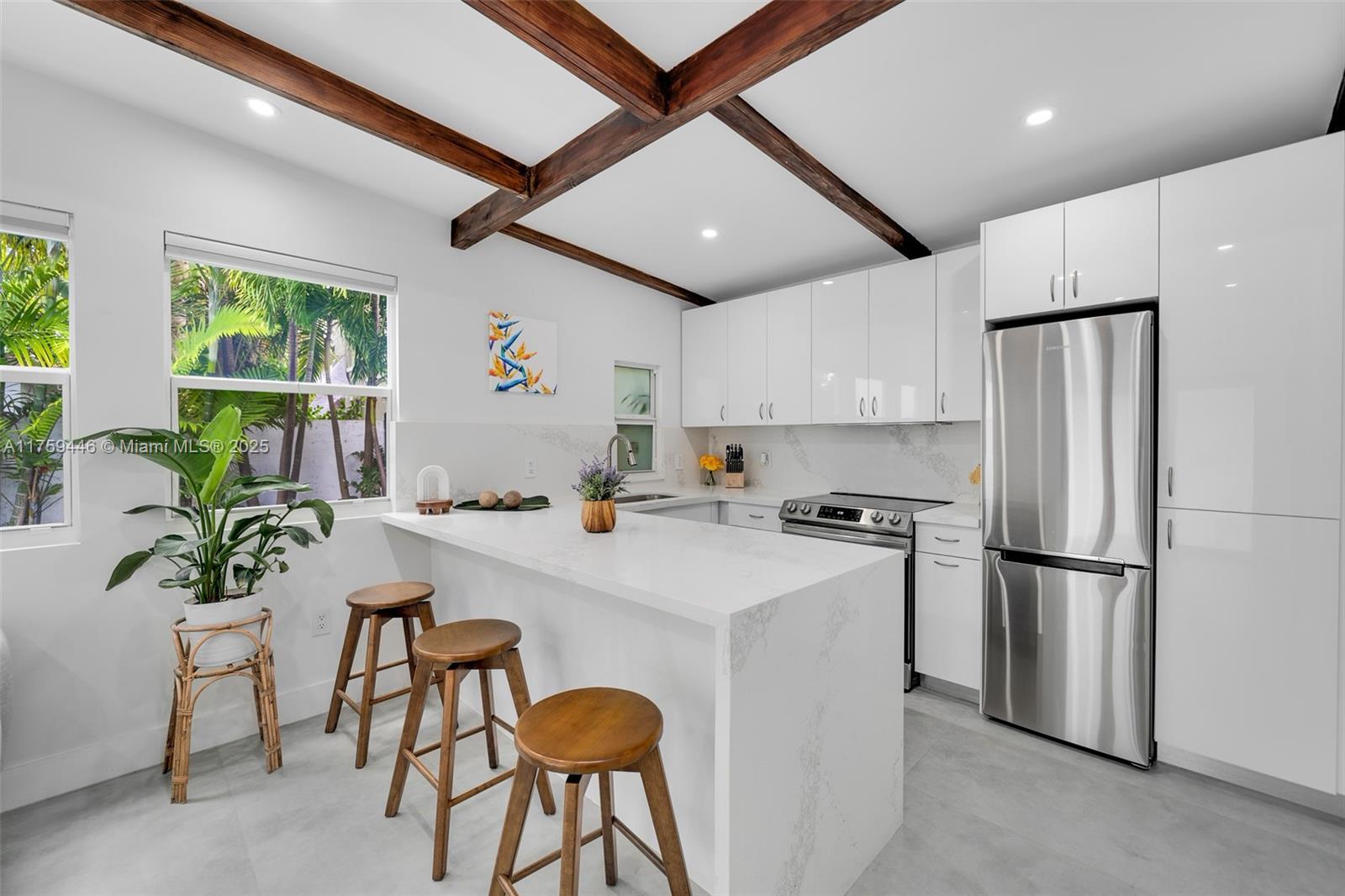 1745 Southwest 10th Street Miami, FL 33135 - Photo 36 of 51 a kitchen with refrigerator a table and chairs