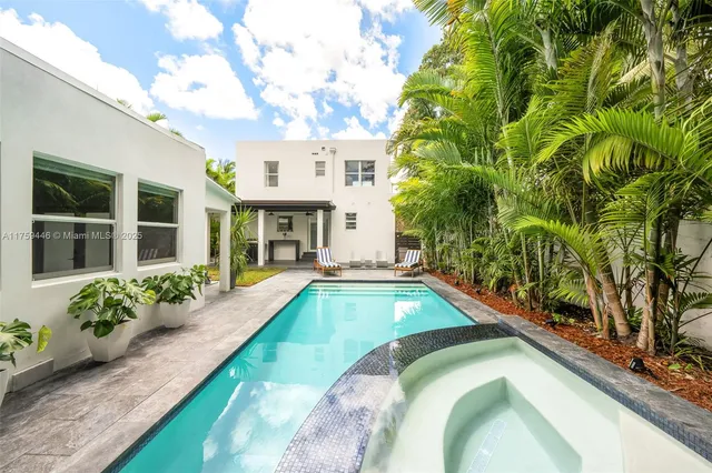 a view of a dinning table and a couches in patio