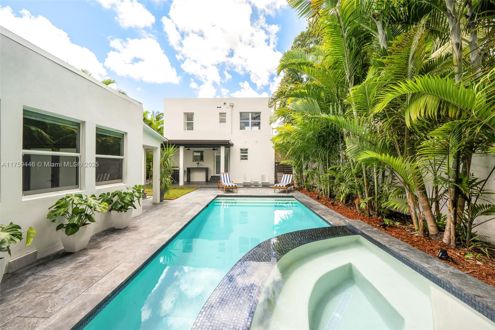 1745 Southwest 10th Street Miami, FL 33135 - Photo 42 of 51 a view of a house with swimming pool and a porch