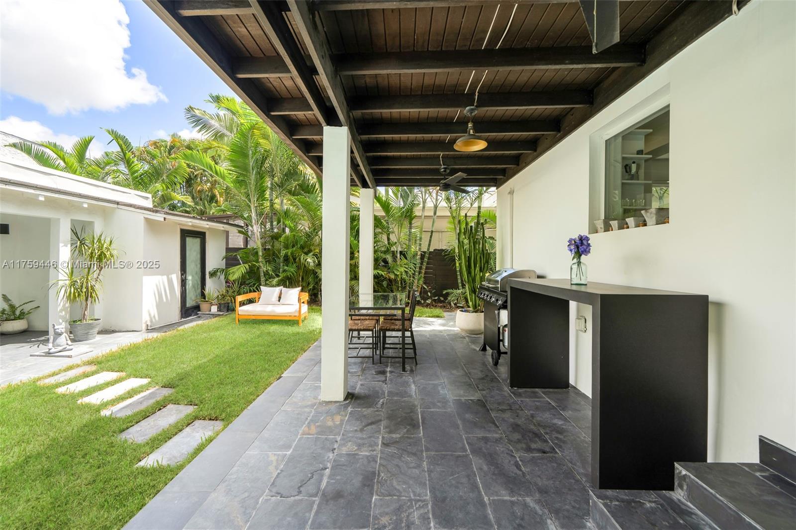 1745 Southwest 10th Street Miami, FL 33135 - Photo 44 of 51 a view of a porch with chairs and backyard