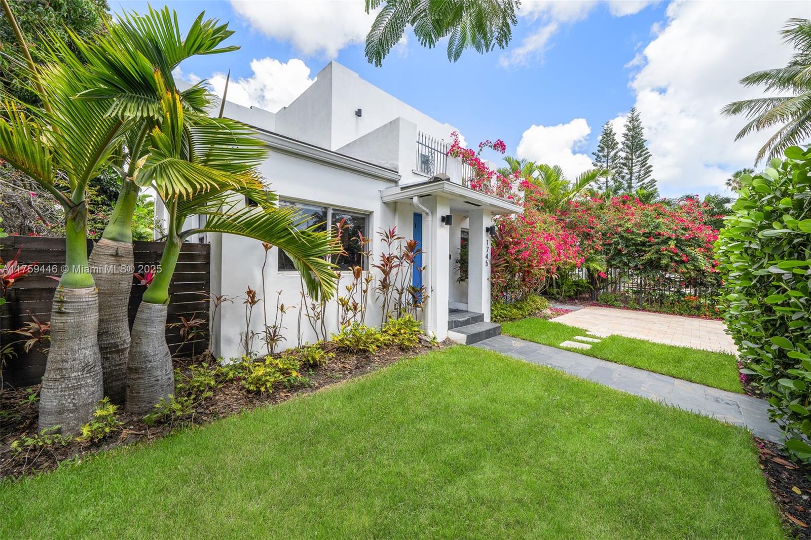 1745 Southwest 10th Street Miami, FL 33135 - Photo 48 of 51 a front view of a house with a yard