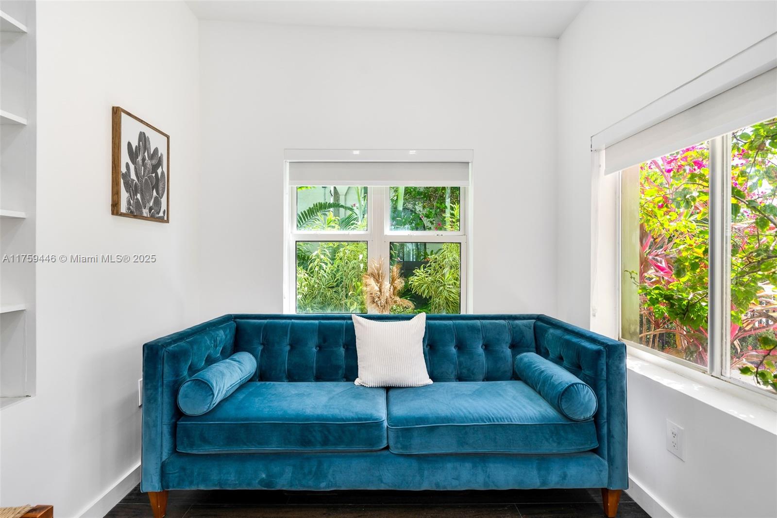 1745 Southwest 10th Street Miami, FL 33135 - Photo 7 of 51 a living room with a couch and a potted plant