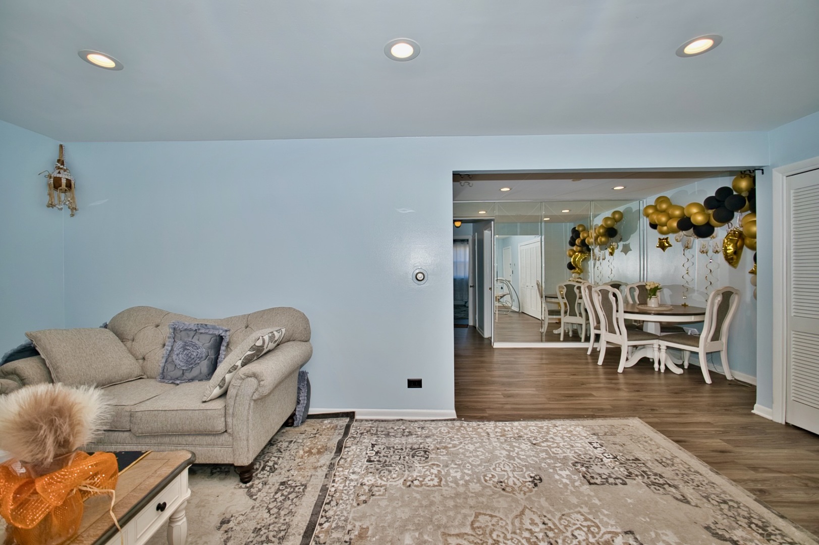 1428 West Fargo Avenue, Unit 303 Chicago, IL 60626 - Photo 13 of 28 a living room with furniture and a dining table with rug