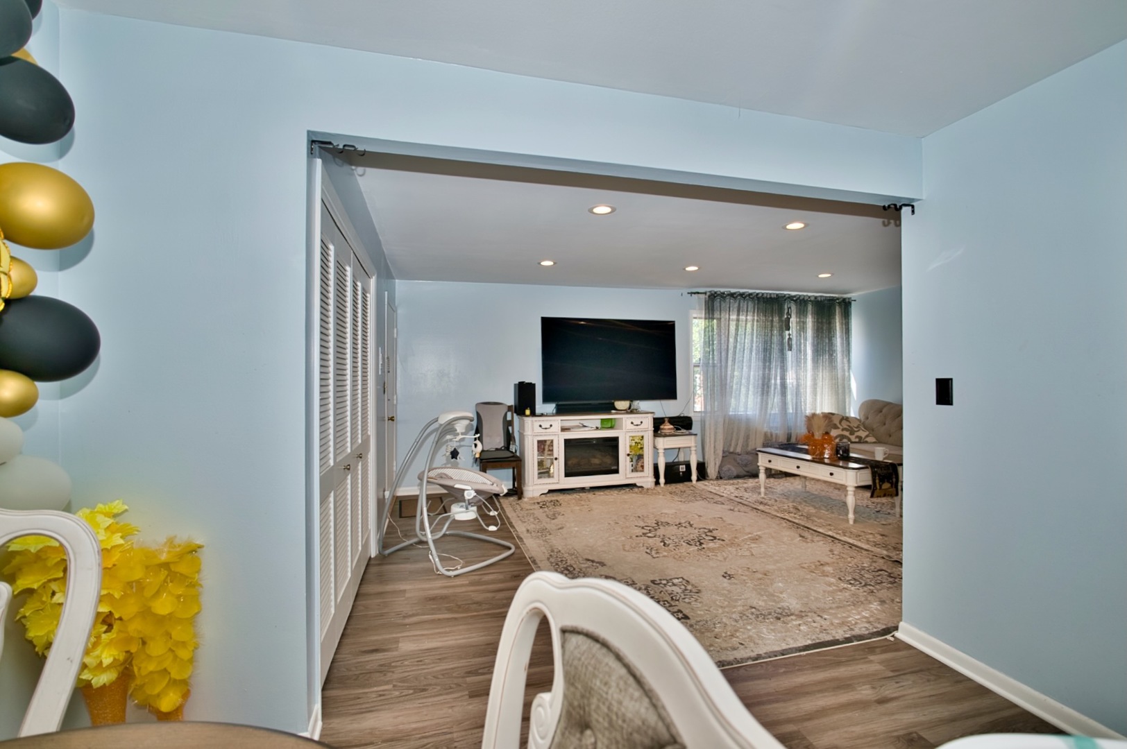 1428 West Fargo Avenue, Unit 303 Chicago, IL 60626 - Photo 16 of 28 a living room with furniture and a flat screen tv