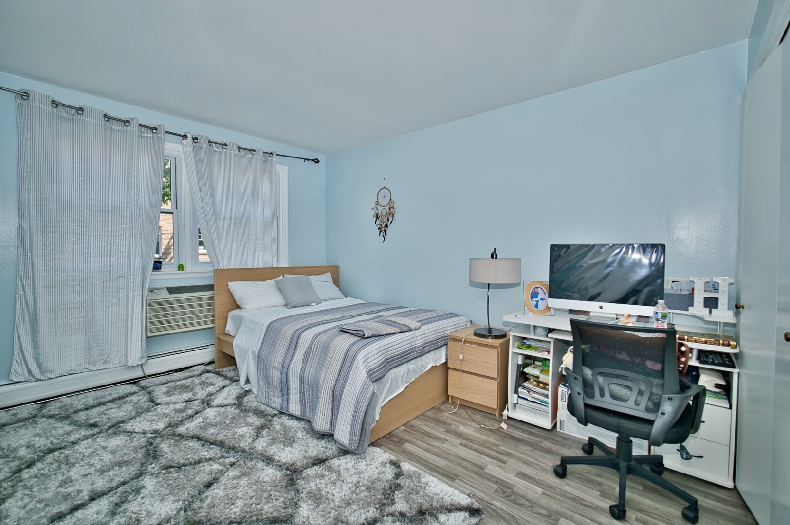 1428 West Fargo Avenue, Unit 303 Chicago, IL 60626 - Photo 22 of 28 a bedroom with a bed and a desk
