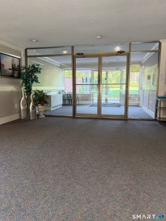 a view of an empty room and a balcony