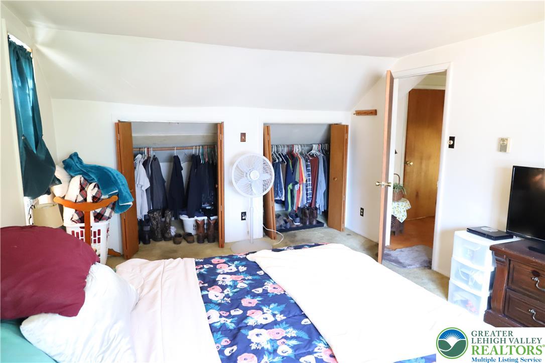 820 Walton Street Bethlehem, PA 18018 - Photo 13 of 18 a bedroom with a bed and a flat tv screen on dresser
