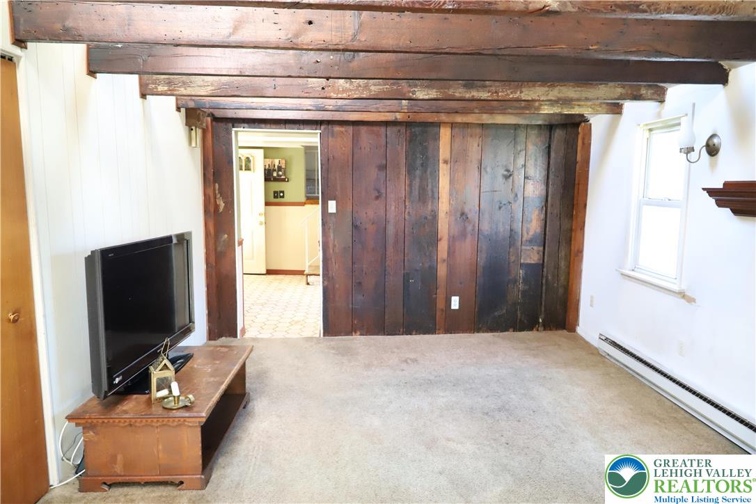 820 Walton Street Bethlehem, PA 18018 - Photo 7 of 18 a bedroom with a bed and a flat screen tv
