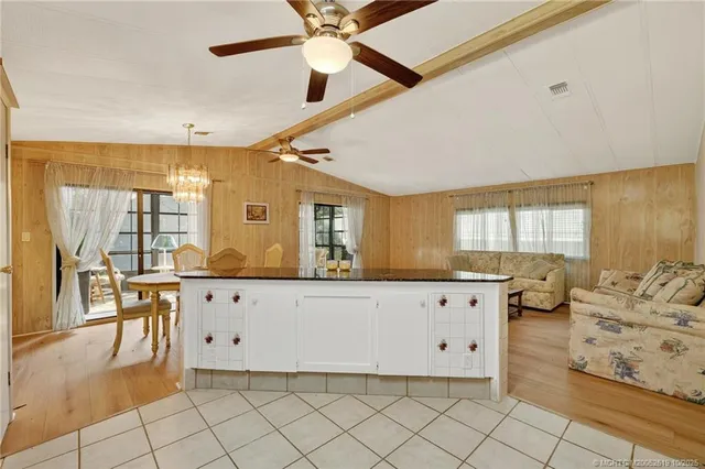 a living room with granite countertop furniture and a large window