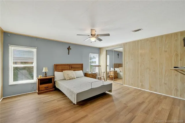 a living room with a bed furniture and a window