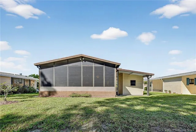 a big house with a big yard and large trees