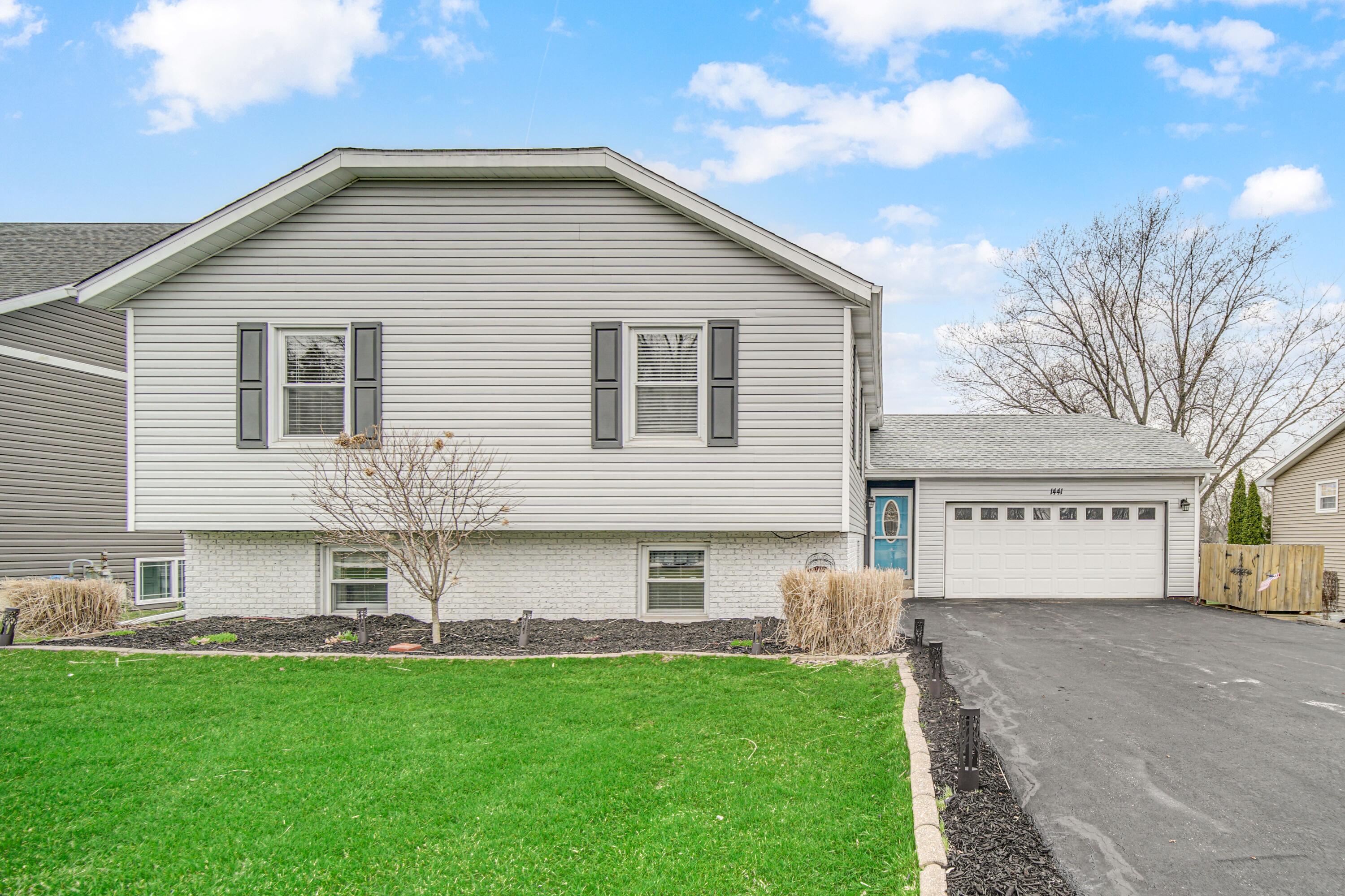 a front view of house with yard