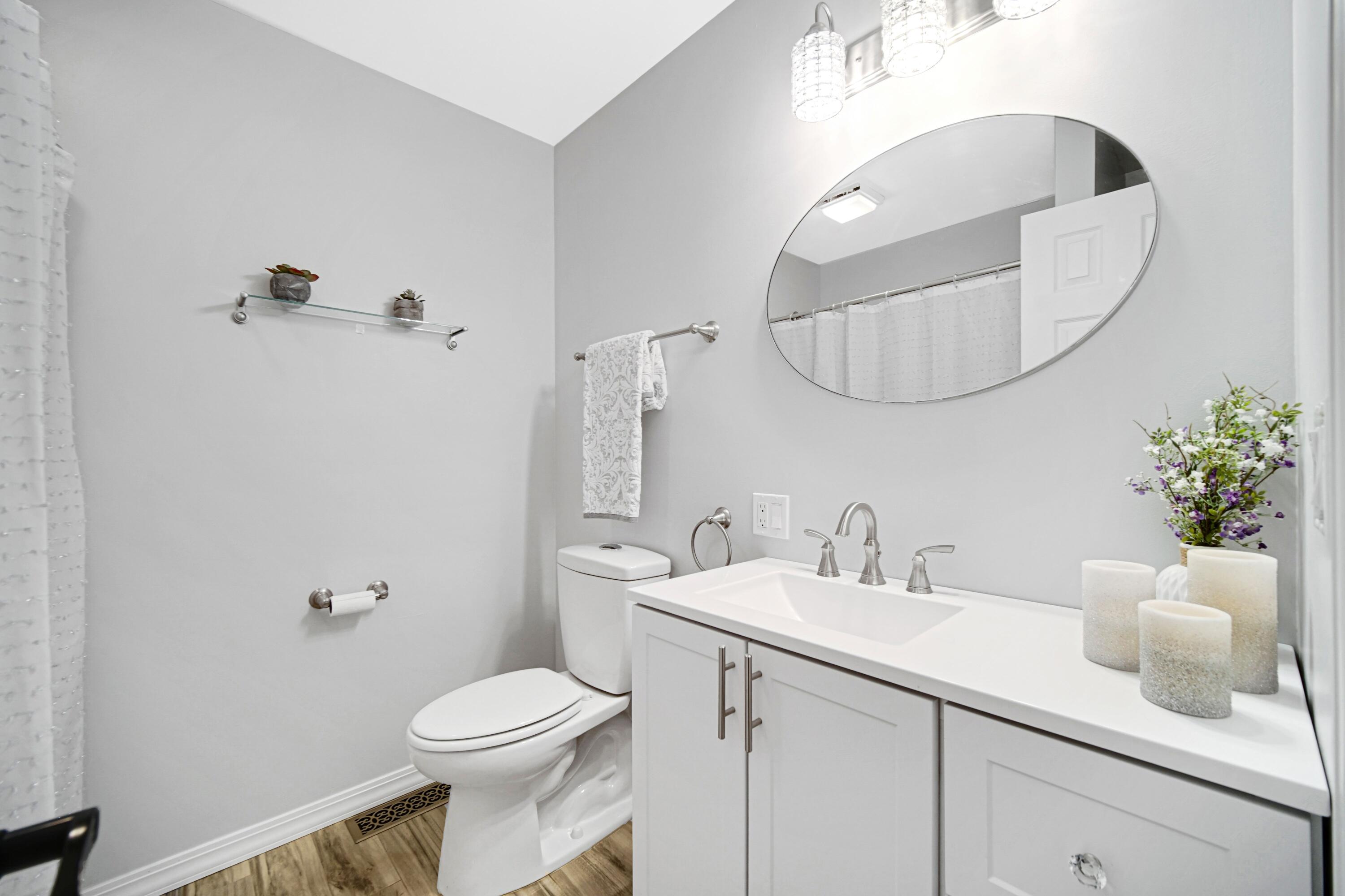 1441 Brandywine Road Crown Point, IN 46307 - Photo 14 of 24 a bathroom with a toilet sink and mirror