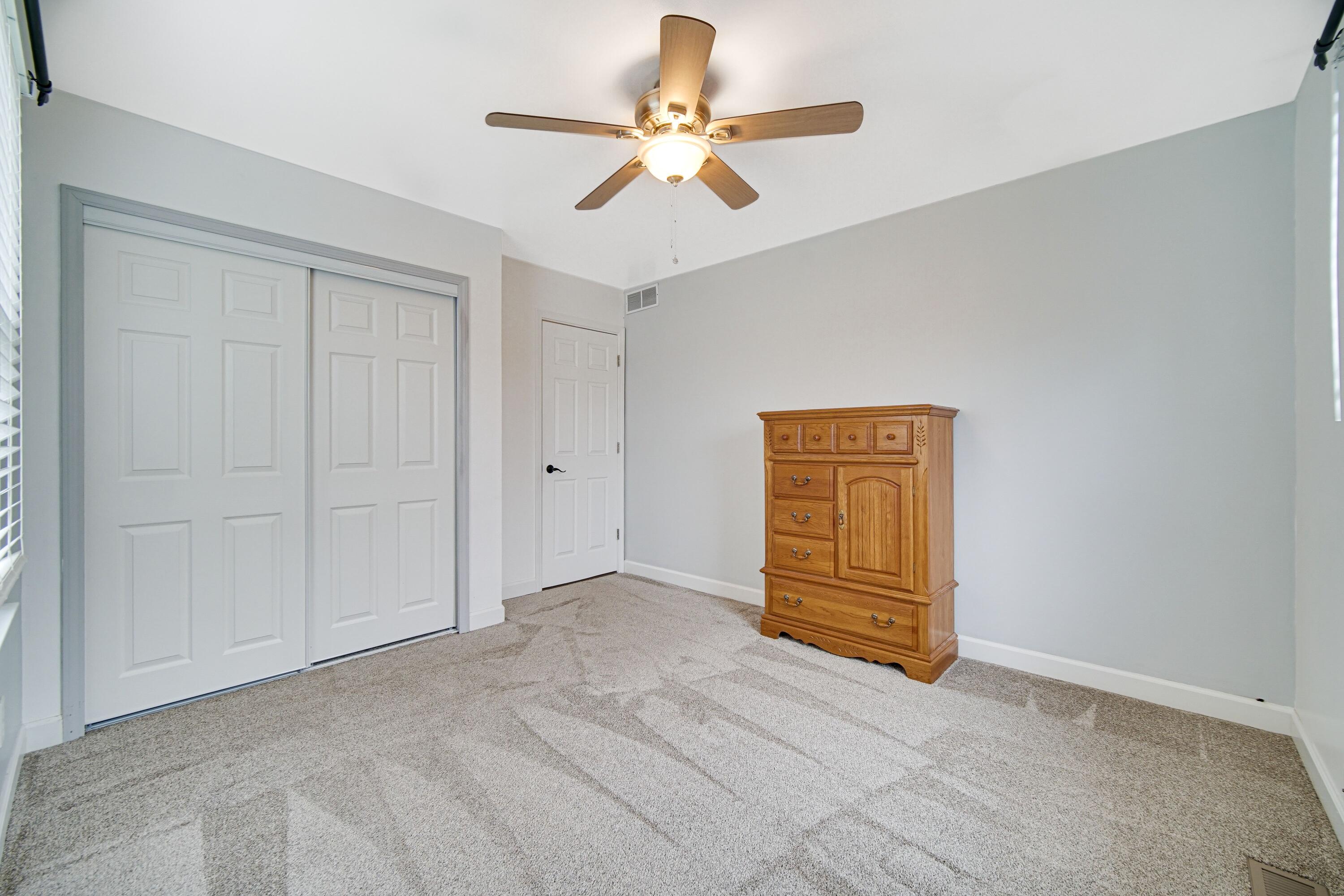 1441 Brandywine Road Crown Point, IN 46307 - Photo 15 of 24 a view of an empty room with a ceiling fan