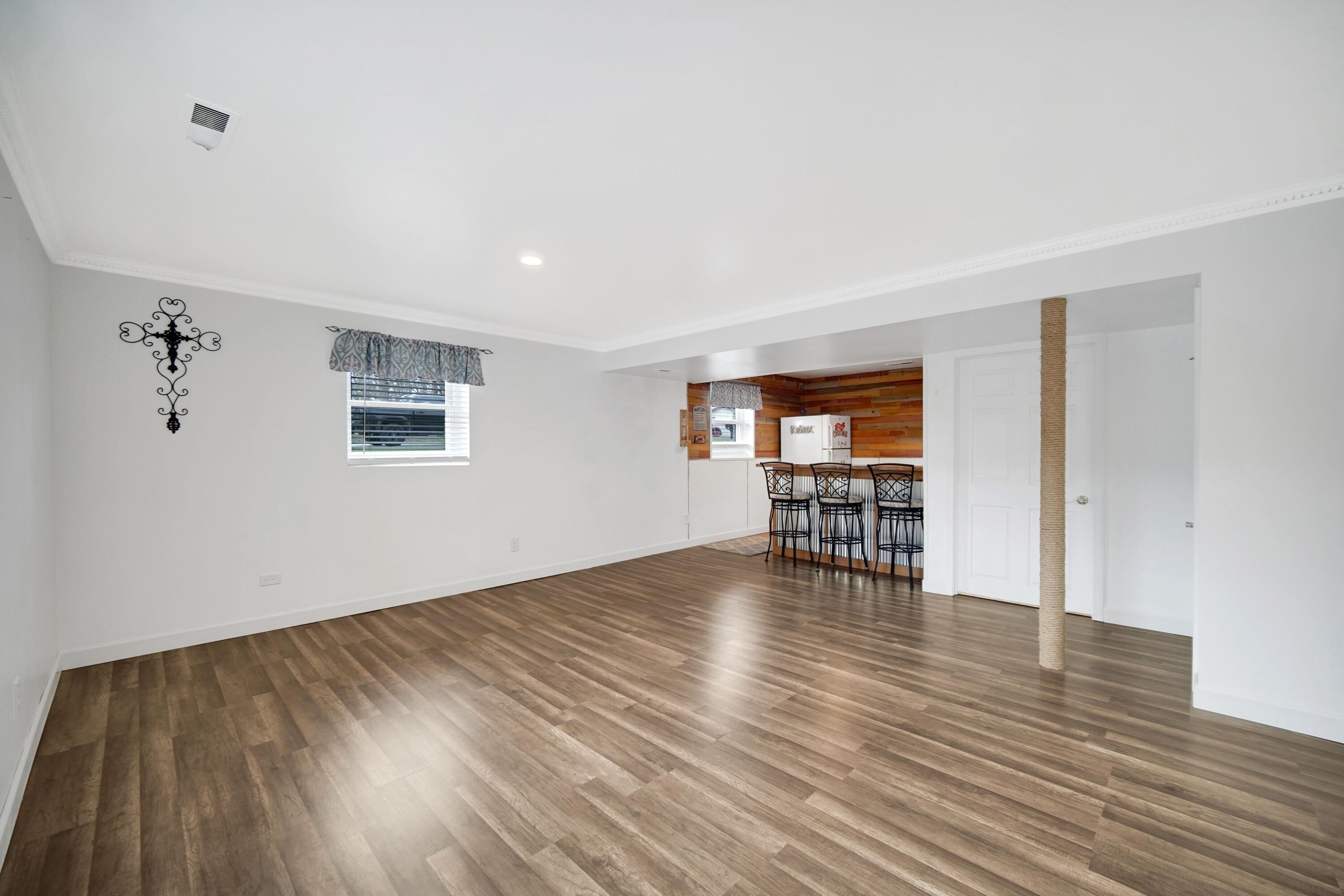 1441 Brandywine Road Crown Point, IN 46307 - Photo 16 of 24 a view of an empty room with window and wooden floor