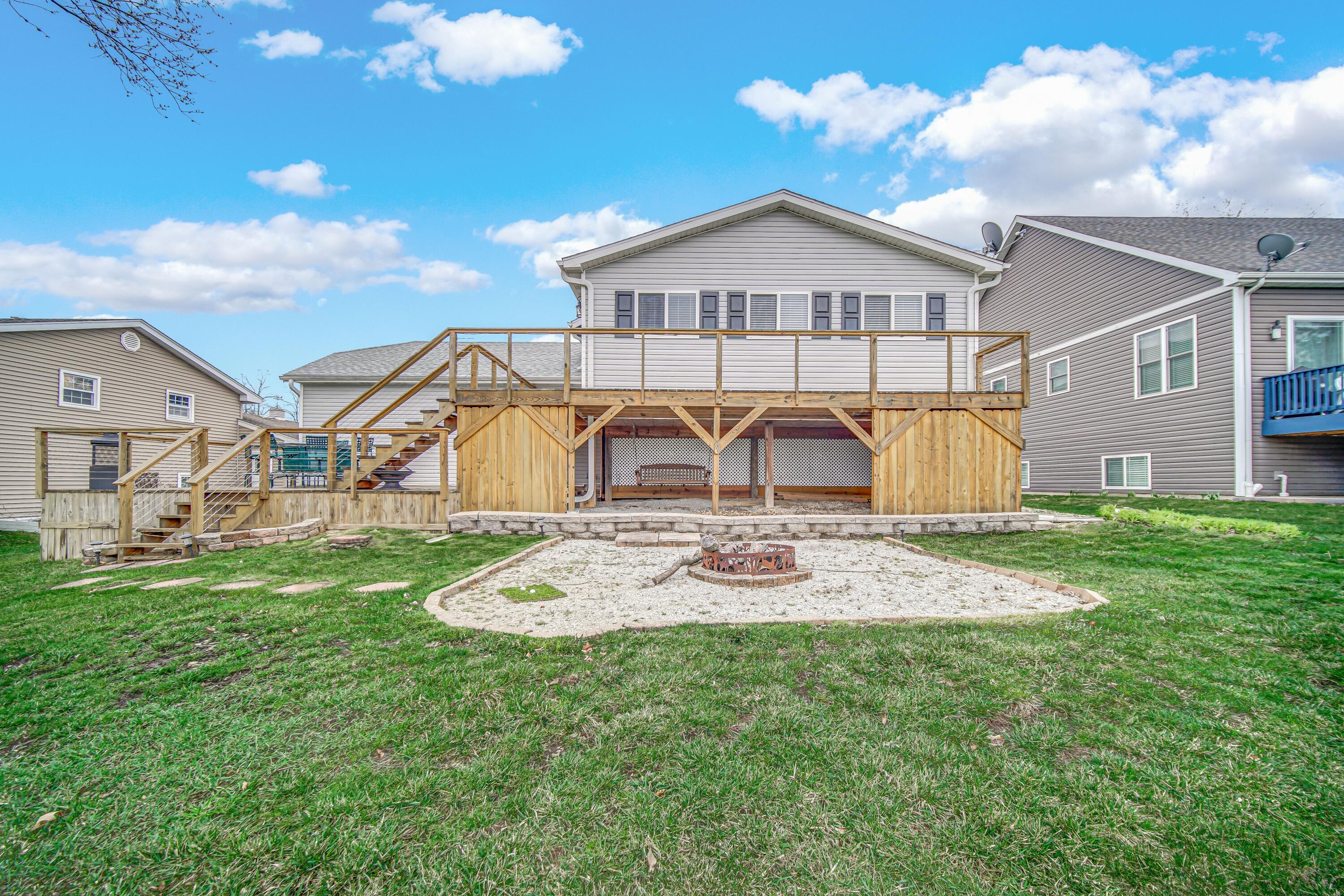 1441 Brandywine Road Crown Point, IN 46307 - Photo 22 of 24 a view of a house with table and chairs