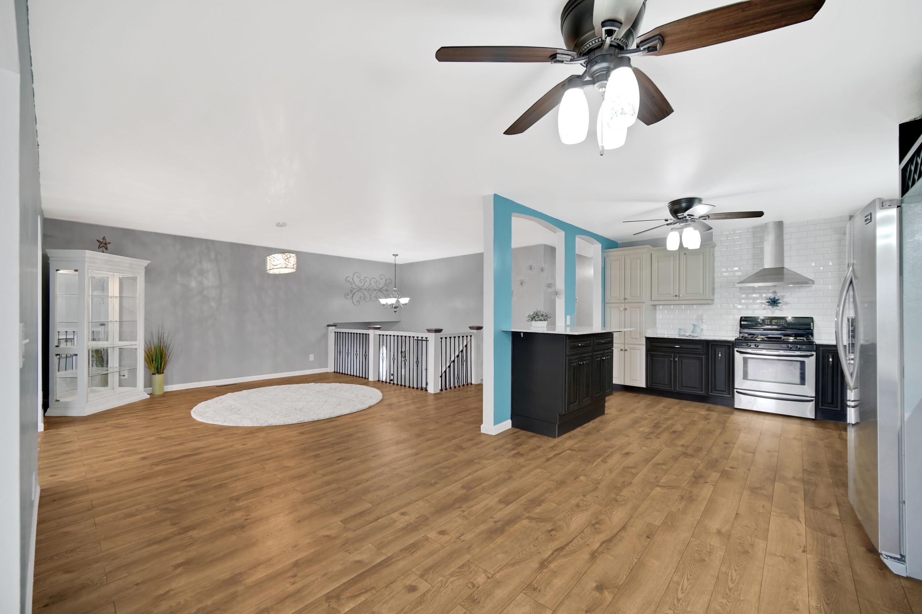 1441 Brandywine Road Crown Point, IN 46307 - Photo 6 of 24 a view of kitchen with sink microwave and refrigerator