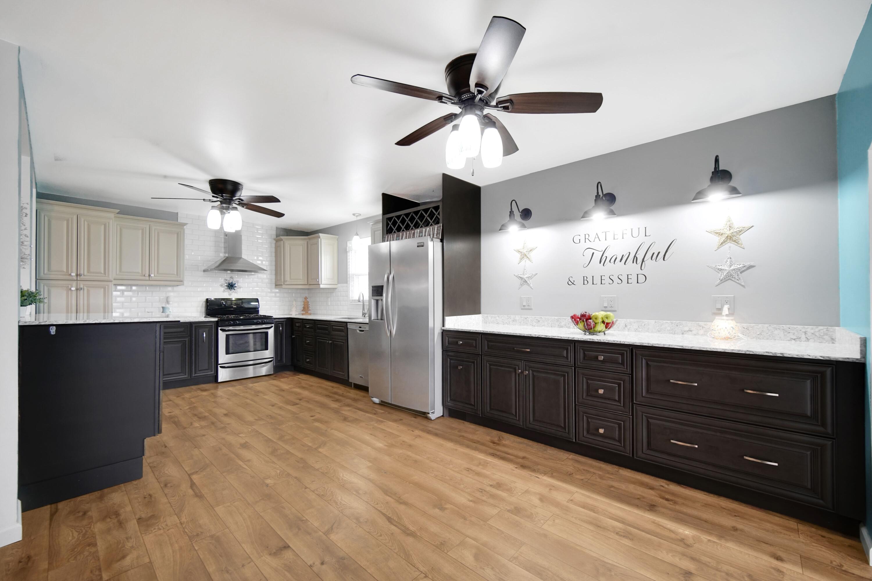 1441 Brandywine Road Crown Point, IN 46307 - Photo 7 of 24 a kitchen with stainless steel appliances kitchen island granite countertop a refrigerator and cabinets