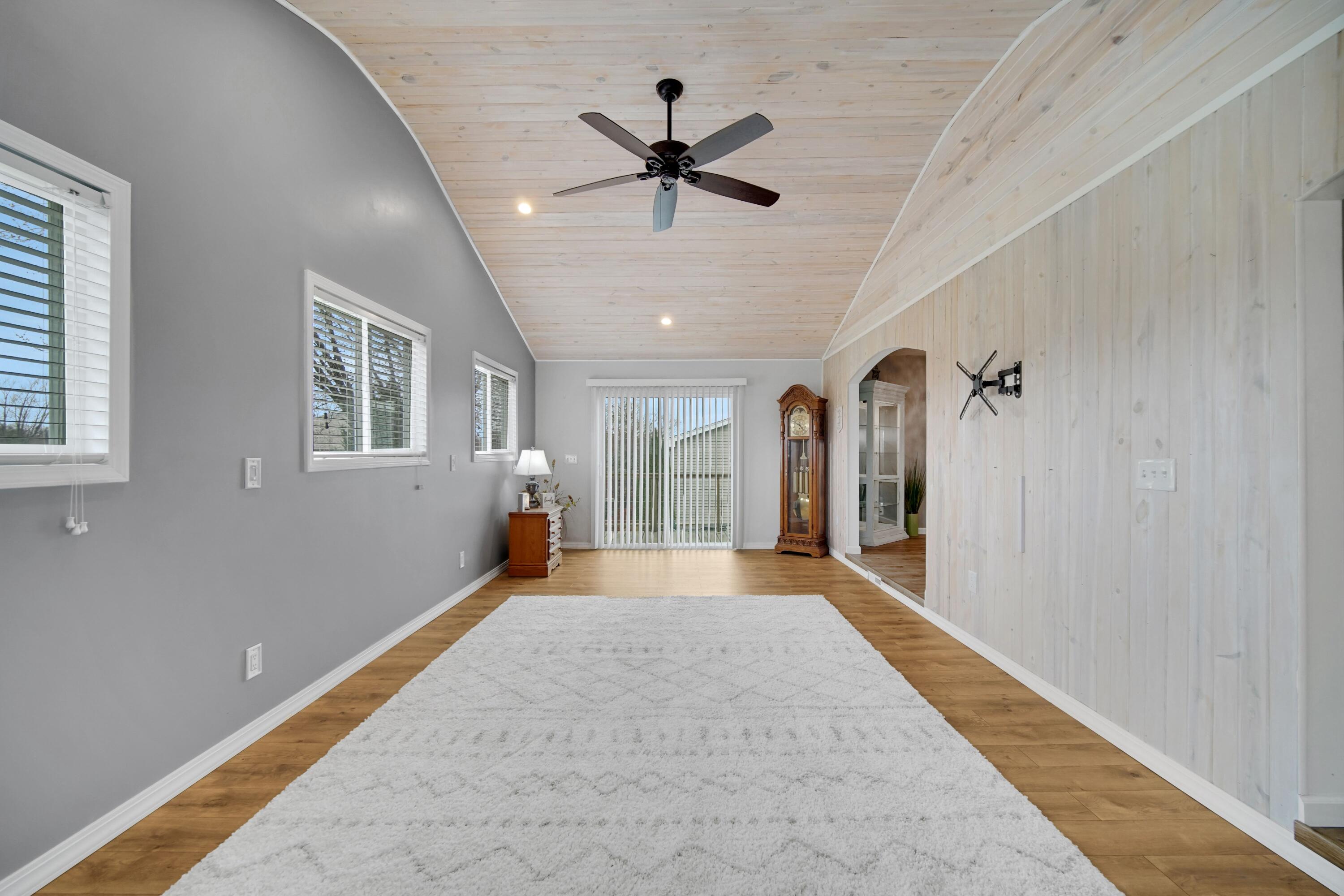 1441 Brandywine Road Crown Point, IN 46307 - Photo 9 of 24 a view of a livingroom with a ceiling fan and window