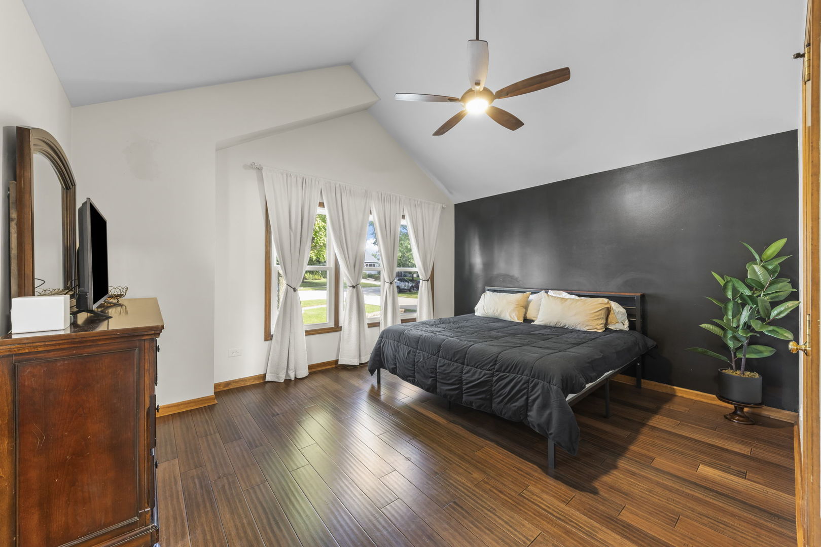 1801 Chestnut Hill Road Plainfield, IL 60586 - Photo 9 of 24 a spacious bedroom with a bed and a flat screen tv
