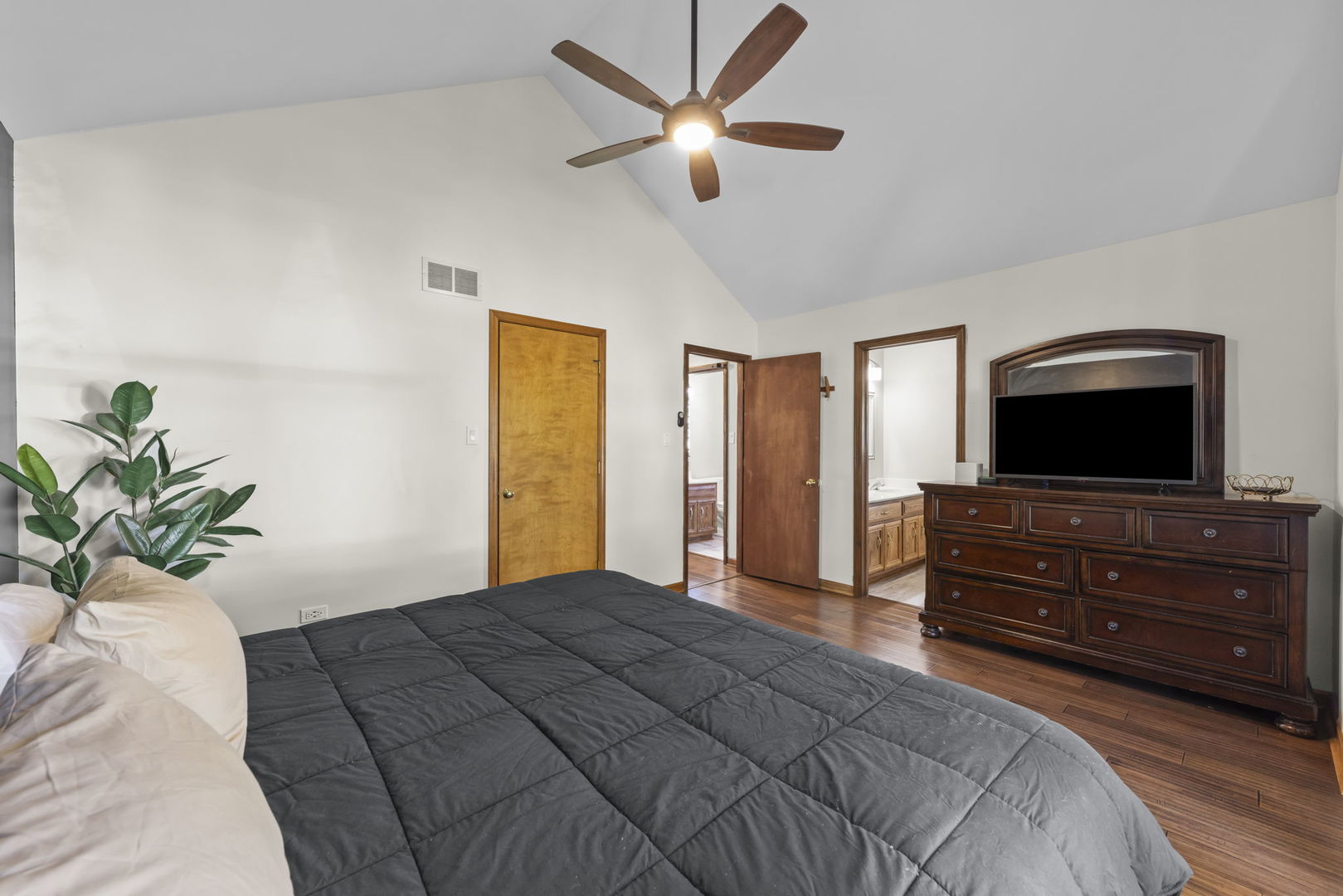 1801 Chestnut Hill Road Plainfield, IL 60586 - Photo 10 of 24 a bedroom with a bed and a flat screen tv