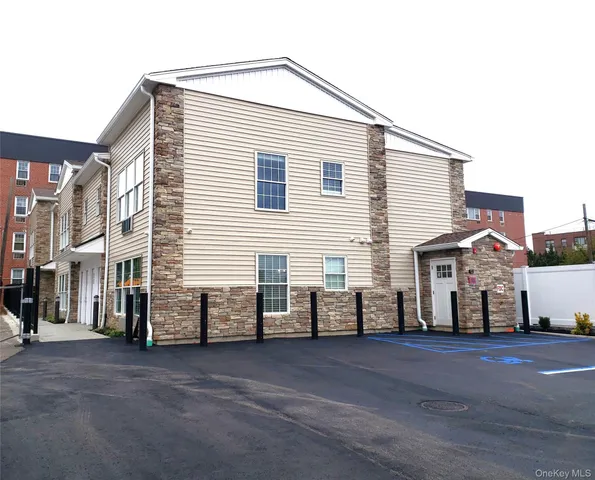 a view of a house with a street