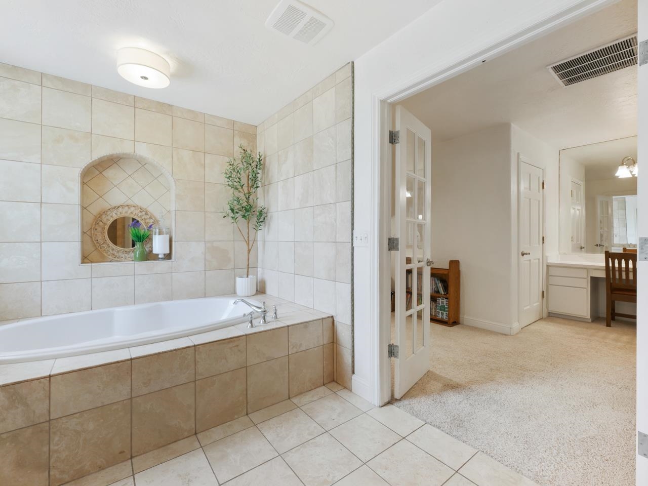 2433 H Road Grand Junction, CO 81505 - Photo 23 of 42 a spacious bathroom with a tub a sink and mirror