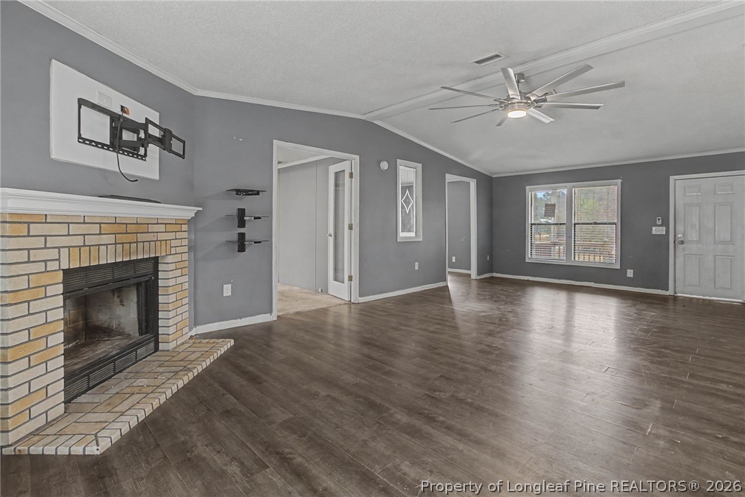 1512 Seabrook School Road Fayetteville, NC 28312 - Photo 8 of 30 a view of an empty room with window and fire place
