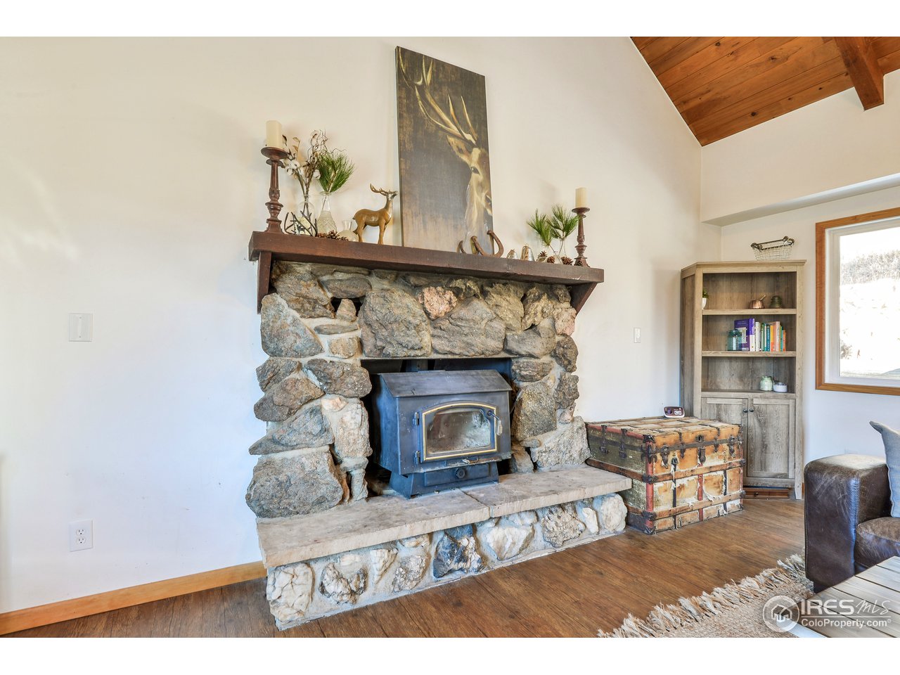 858 Stove Prairie Road Bellvue, CO 80512 - Photo 8 of 37 Fireplace from Local Rock & Insert