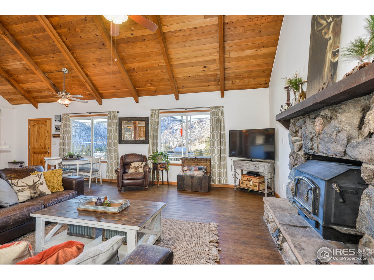 858 Stove Prairie Road Bellvue, CO 80512 - Photo 10 of 37 Warm and Inviting Living Room