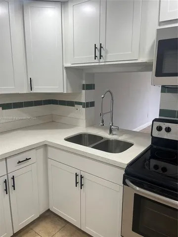 a bathroom with a shower and a bath tub