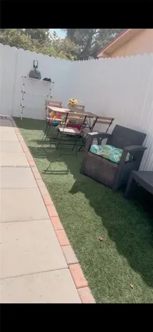 a view of swimming pool from a yard