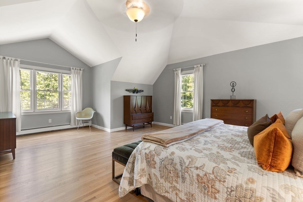 9 Bragg Road Foxboro, MA 02035 - Photo 23 of 42 a bedroom with a bed and wooden floor