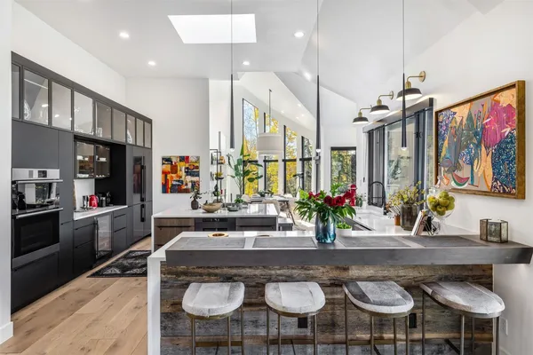 a kitchen with stainless steel appliances granite countertop a stove and a refrigerator