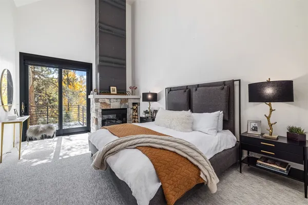 a room with a large window and furniture