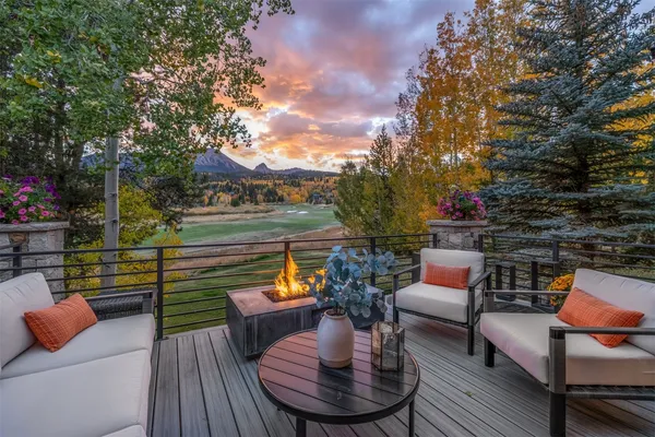 a outdoor living space with patio furniture and a fire pit