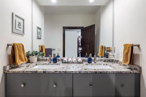 a room with gym equipment and a flat screen tv