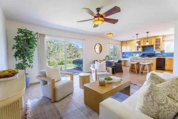 a living room with furniture and a large window
