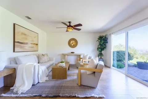 a view of a swimming pool and lounge chairs