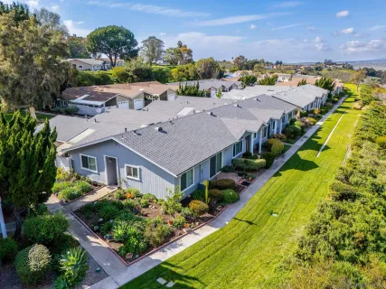 an aerial view of a house with a garden