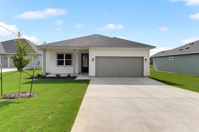front view of a house with a yard