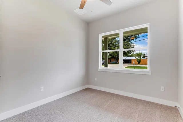 an empty room with closet area